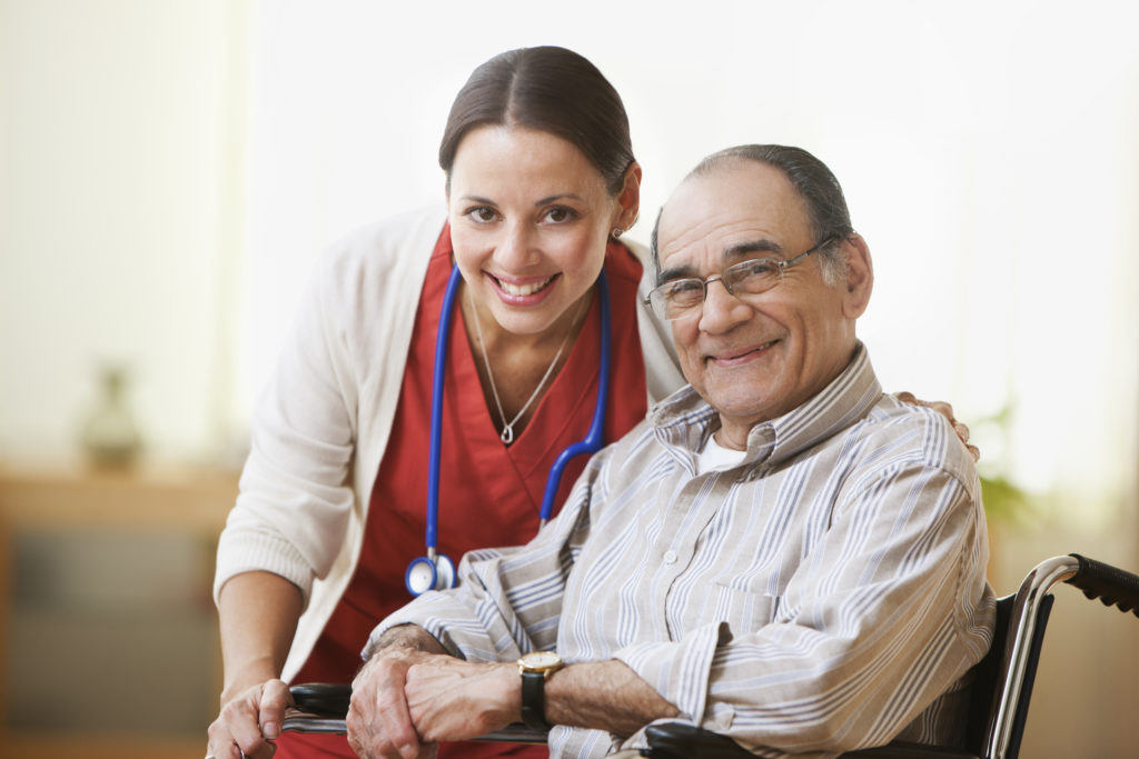 Portrait of a nurse and an elderly man smiling